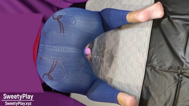 Big ass in jeans peeing with vibrator