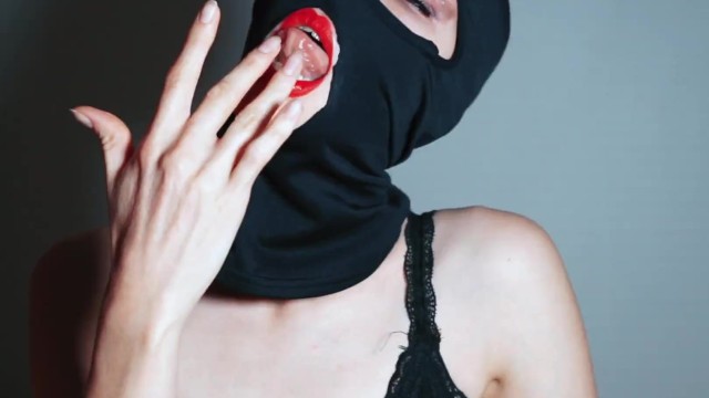 pussy in a balaclava with a rough tongue licks herself